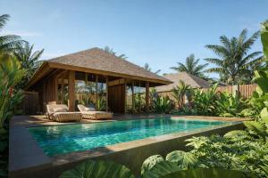 a villa with a swimming pool in a resort at Kappa Senses Zanzibar in Pwani Mchangani