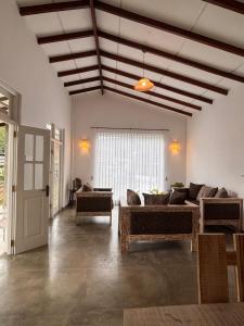 a living room with a couch and a table at Villa Aureia in Bandarawela