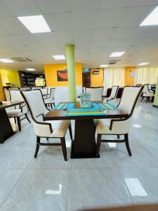 a conference room with a table and chairs at KIJICHI GATEWAY Hotel in Dar es Salaam