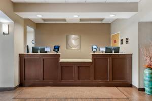 a lobby with a reception desk with two computers at Comfort Inn & Suites Wildwood - The Villages in Wildwood +30 photos