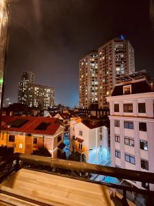 a view of a city at night with buildings at Nam Cường X Hotel in Hanoi