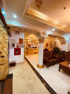 a living room with a couch and a table at Nam Cường X Hotel in Hanoi