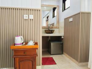 a small bathroom with a sink and a counter with aounter at Sama Sama Amed in Amed +180 photos