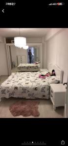 a bedroom with two beds and a person in the mirror at Expo Copou in Iaşi