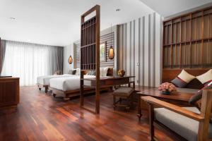 Postel nebo postele na pokoji v ubytování J7 Angkor Hotel + 37 fotografií