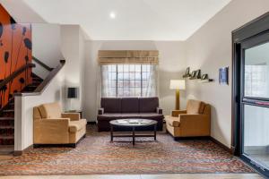 a living room with a couch and two chairs at Sleep Inn Billings in Billings