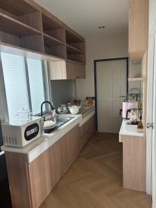 a kitchen with a sink and a counter top at Vanilla Villa in Ban Yep Chaeng