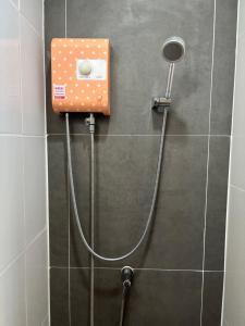 a shower with a soap dispenser on a wall at Vanilla Villa in Ban Yep Chaeng +24 photos