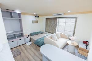 a living room with a couch and a table at Hội Home in Ho Chi Minh City
