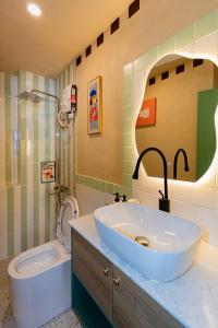 a bathroom with a sink and a toilet at Hội Home in Ho Chi Minh City +17 photos