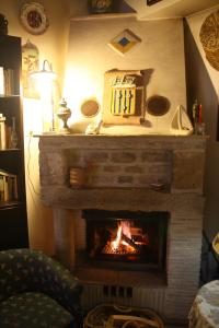a fireplace that has a fire place in it at Hotel Elimo in Erice