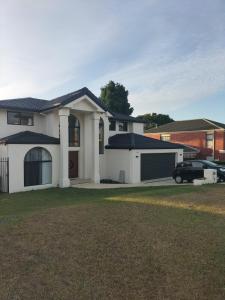 a house with a car parked in front of it at Maisie Haven in Brisbane