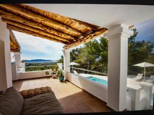 a villa with a swimming pool and a patio at Villa Casiopea in Illes Balears