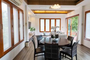 a dining room with a table and chairs at Premium Villa Baan Kinlom Chomlay in Hua Hin