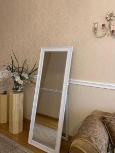 a mirror in the corner of a bedroom at classic in Daugavpils
