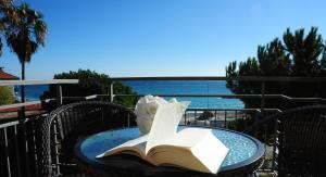a table with an open book on top at Sole Mare in Ventimiglia