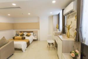 Postel nebo postele na pokoji v ubytování CA&SA Serviced Apartment + 37 fotografií