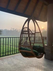 a hanging hammock on a balcony with a view of the ocean at Casa Monkey 28 in Bentota +17 photos