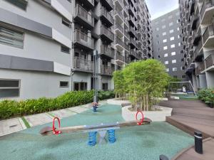 a playground in the middle of a building at Chic Urban Escape at S Residence Tower 3 in Manila