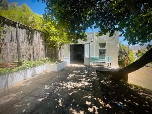a bench sitting in front of a building at Intimate Studio for Two at Hebron Estate in Piketberg