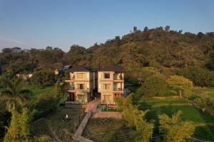 an aerial view of a house on a hill at Ramjay Corbet Jungle Resort in Kotdwāra