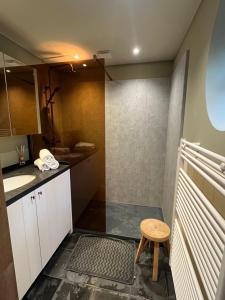 a small bathroom with a sink and a stool at oh deer in Aalter +10 photos