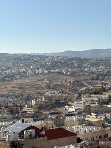 an aerial view of a city with buildings at Golden Stay in Jerash