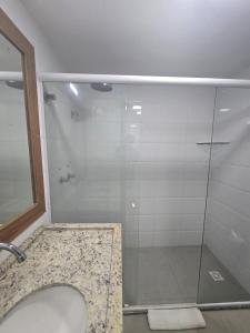 a bathroom with a shower with a glass door at Nobile Imperial Flat in João Pessoa +14 photos