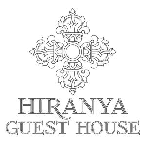 a black and white logo for a guest house at Hiranya Guest House in Pātan