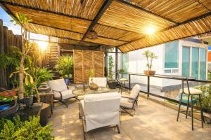 an outdoor patio with chairs and a table at Amazing View From Los Fuertes in Puebla
