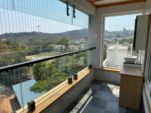 a balcony with a view of a city at The VP Residency Towerrs in Tiruttani