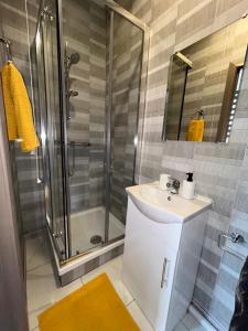 a bathroom with a sink and a shower at S5 Private Ensuite Room for Professionals AND contractors LNG Grain digs in Gillingham