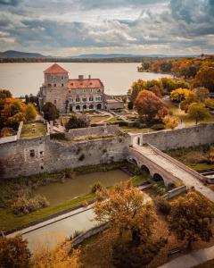 an aerial view of an old castle and a river at Szent Iván Vendégház in Tata