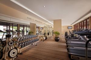 a fitness room with many rows of tread machines at Pan Pacific Suzhou -Including unlimited access to the 4A-level Panmen Scenic Area in Suzhou