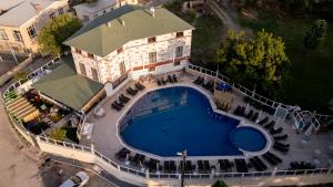 an overhead view of a swimming pool in front of a house at Livadi Jur in Akçakoca
