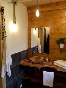 a bathroom with a sink and a mirror at Casa PerAria in Paluzza