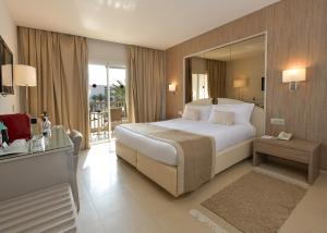 a bedroom with a large bed and a large mirror at Tour Khalef in Sousse +21 photos