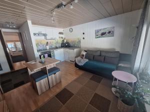 a living room with a couch and a table at Vögelhof in Doren