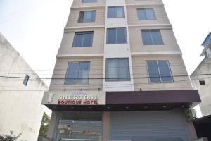 a building with a sign that reads sherhews vacuum repair at Hotel Jaipur Shertone in Jaipur