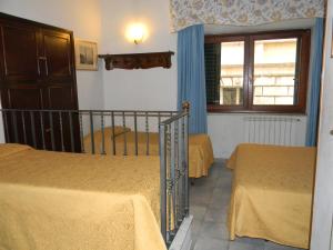 Postel nebo postele na pokoji v ubytování Hotel Primavera