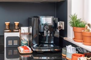 a coffee maker sitting on top of a counter at roeselare stay in Roeselare