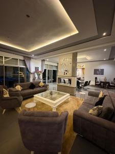 a large living room with couches and a fireplace at Villa Sofia And Spa in Marrakesh