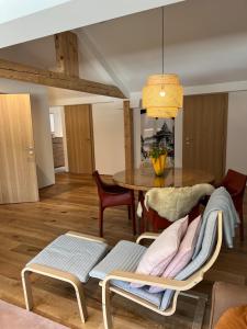 a dining room with a table and chairs at Ari Apartment Wald am Arlberg in Wald am Arlberg