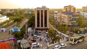 a city with a clock tower in the middle of a street at Hotel Sagar Sonnet in Haldia