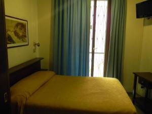 Postel nebo postele na pokoji v ubytování Hotel Primavera