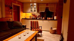 a living room with a couch and a table at Kakerdaja Private Sauna in Vose