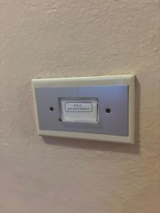 a lightswitch on a wall in a room at Passo Carezza Club Apartment in Carezza al Lago