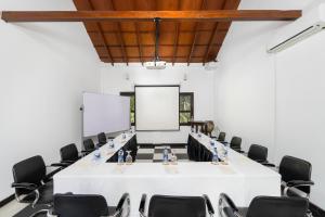 a conference room with a white table and chairs at Serendib Signature Resort in Digana +97 photos