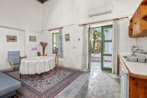 a kitchen with a table and a sink at Antonys Garden House in Episkopi Limassol