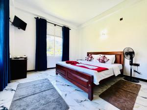 a bedroom with a bed and a window at Mist Cave Ella in Etimale +68 photos